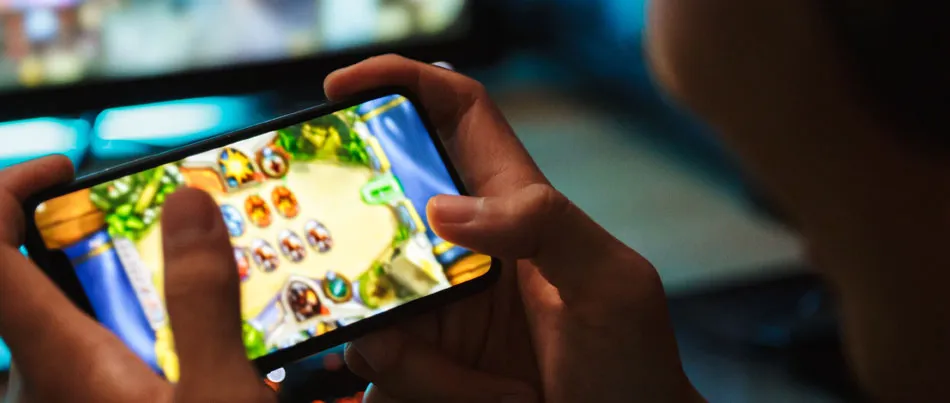 A person playing game on a mobile phone