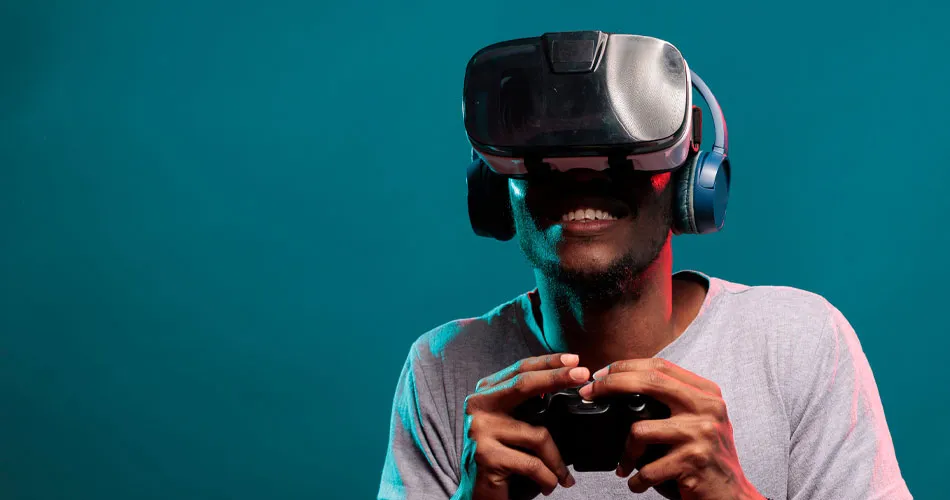 A man playing games using a VR headset and controller