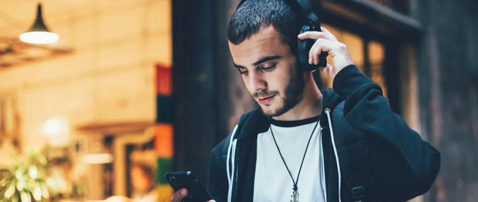 A man listening to music on headphones
