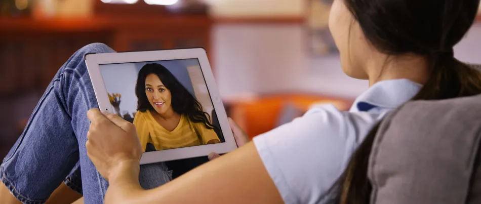 Two women in a video call on an iPad